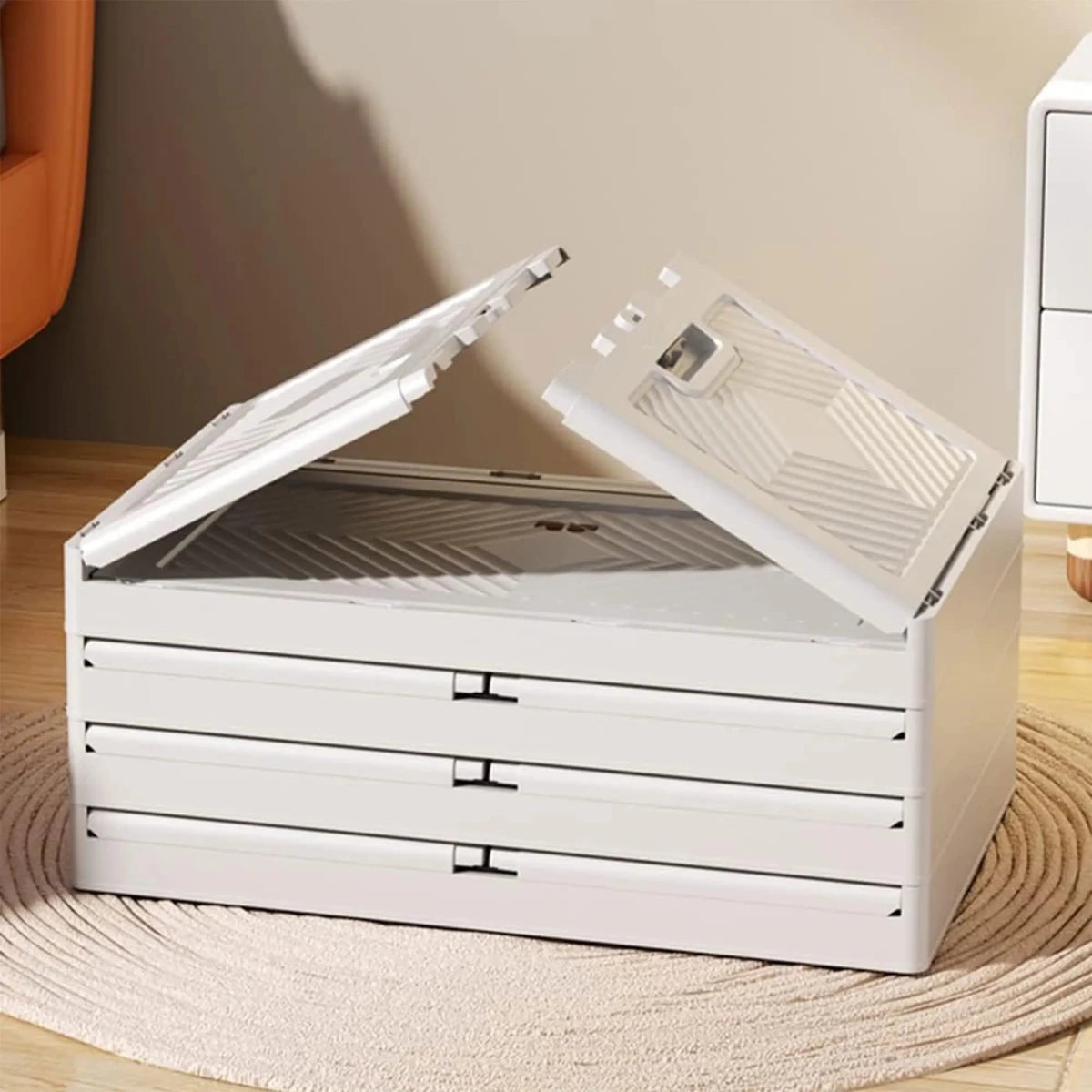 Plastic storage cabinet with three tiers, versatile organization unit in black with open shelves for home or office use.