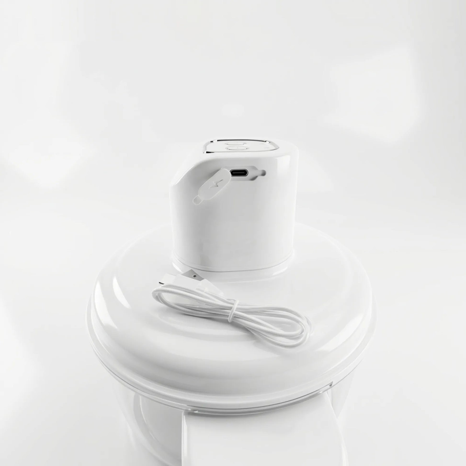 Electric smart fruit and vegetable peeler with rechargeable battery from tasawqli.store, showing the device in use peeling produce.